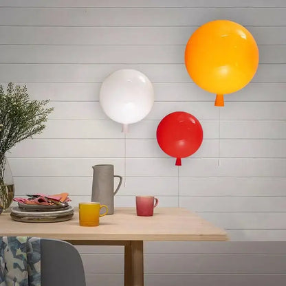 Decorbites colorful balloon memory led wall lamp in white red and orange glossy finish against light gray shiplap wall