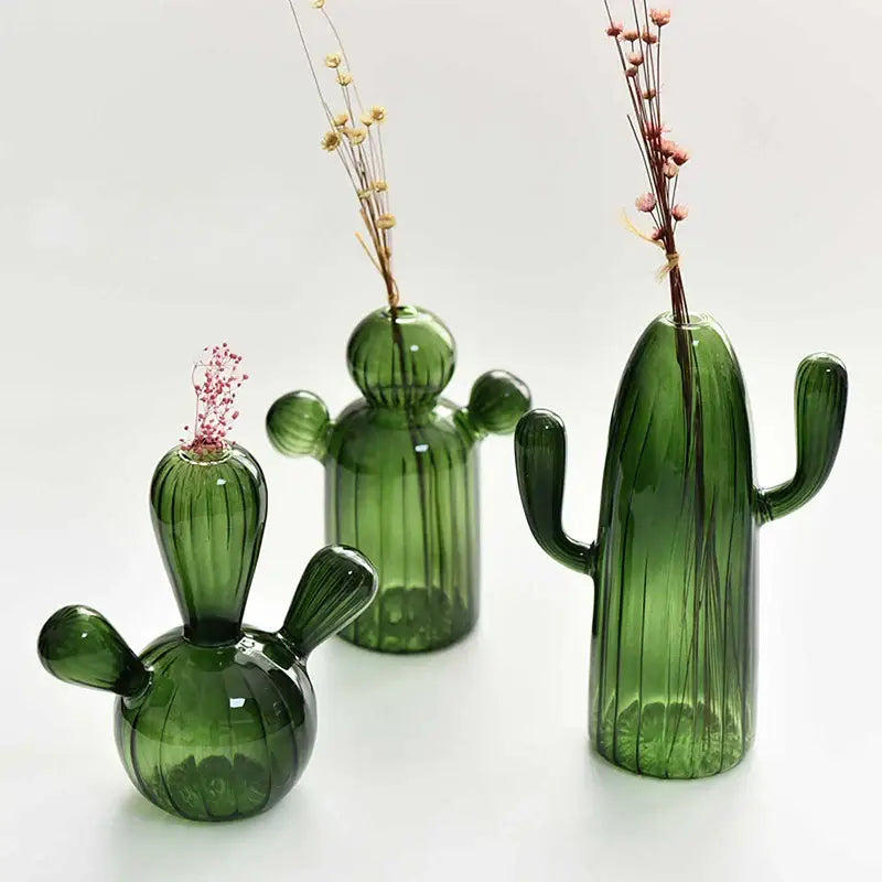 Set of three colorful glass cactus vases in green with dried floral arrangements for home decor by decorbites