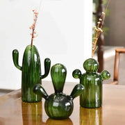 Three green cactus glass vases with unique designs holding dried floral stems for decorbites home decor
