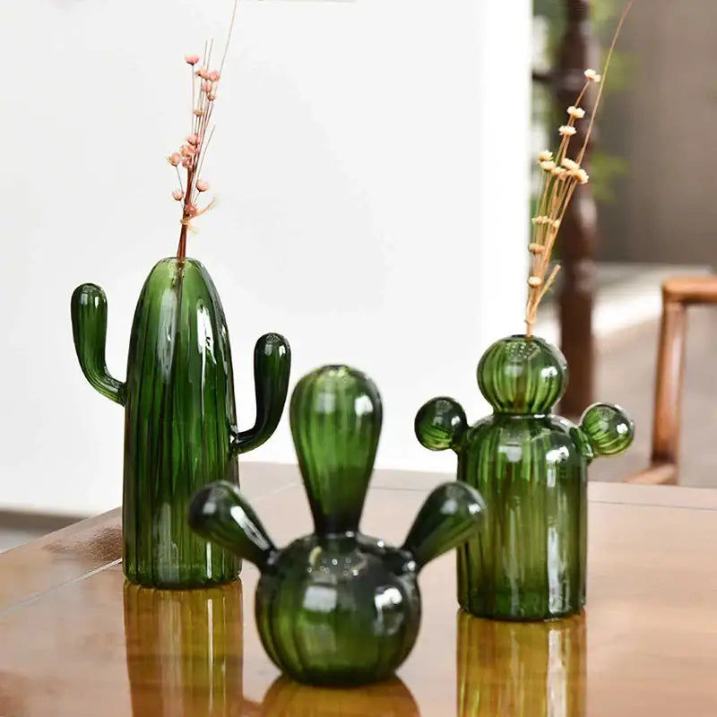 Three green cactus glass vases with unique designs holding dried floral stems for decorbites home decor