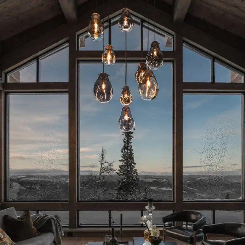A cluster of warm-toned glass-encased bulbs in the decorbites colorful glass chandelier pendant light