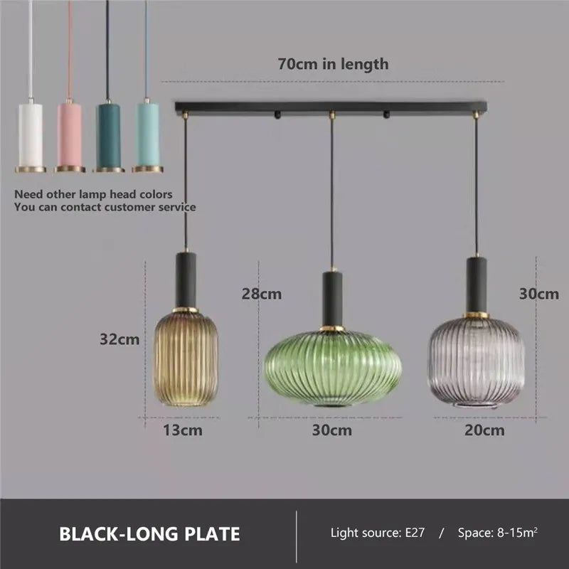 Set of three colorful glass pendant lights with ribbed shades in gold, green, and clear hues by DecorBites pendant lights
