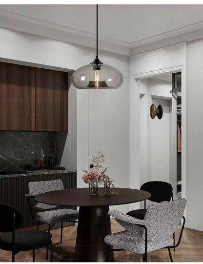 Modern glass colorful led pendant lights with sleek black metal fixture and warm bulb for restaurant decorbites