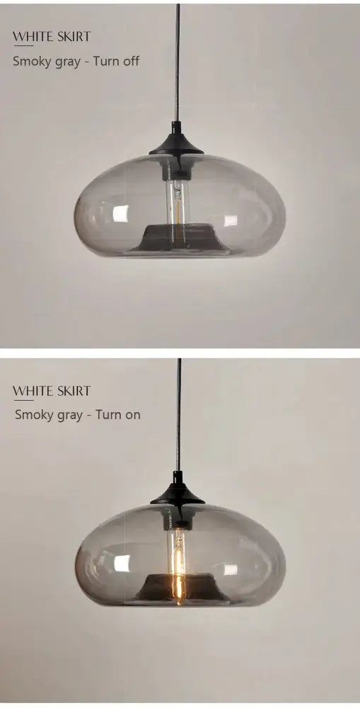 A sleek smoky gray glass colorful led pendant light with black metal fixture and exposed filament bulb for restaurant use