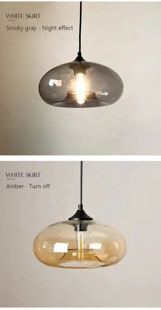 A sleek glass colorful LED pendant light with a smooth rounded dome and amber glow for restaurant decor