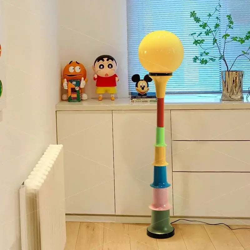 Decorbites colorful memphis floor lamp with glossy yellow sphere and stacked red green blue pink olive cylinders for bedroom