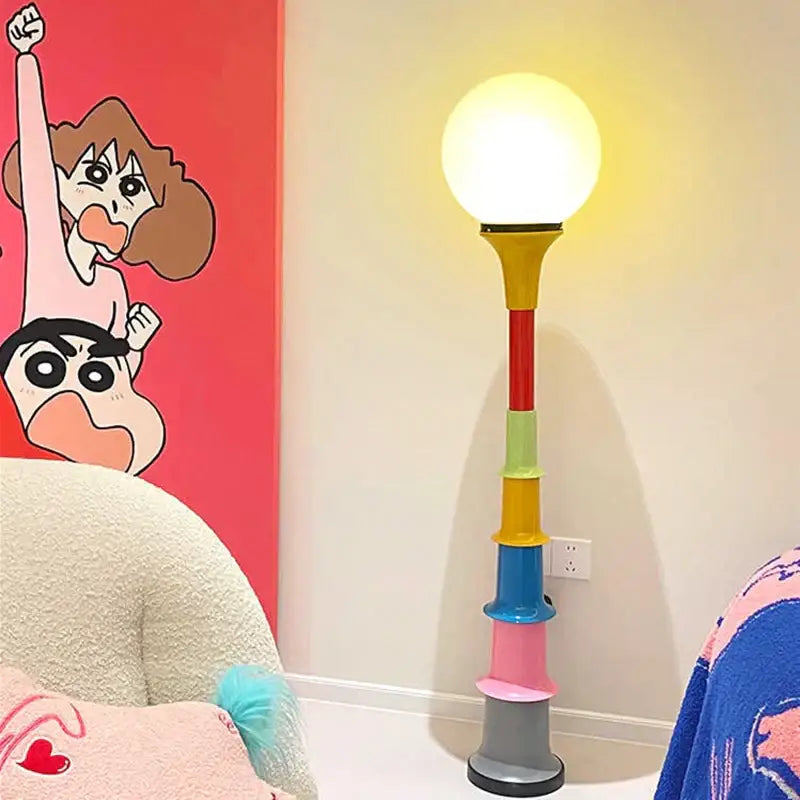 Decorbites colorful memphis floor lamp with bright yellow globe shade and multicolored stacked cylindrical base for bedroom lighting