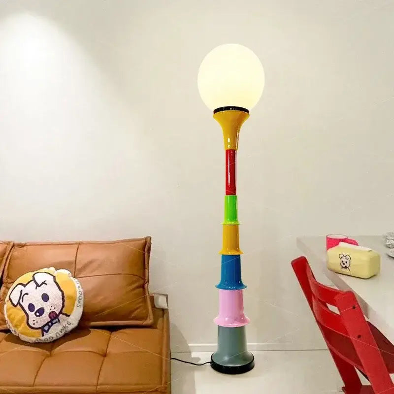 Decorbites colorful memphis floor lamp with a rainbow stacked cylindrical base and white spherical led bulb for bedroom lighting