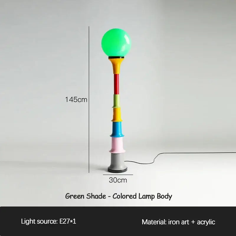 A 145cm decorbites colorful memphis floor lamp with a glowing green shade and segmented acrylic iron art body for bedroom