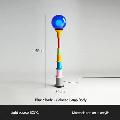 A vibrant 145cm decorbites colorful memphis floor lamp with a glossy blue spherical shade and acrylic stacked segments