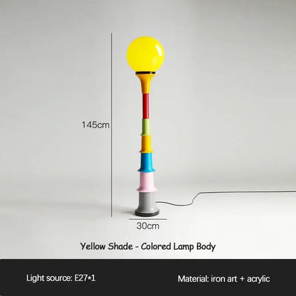 A 145cm tall decorbites colorful memphis floor lamp with a glossy yellow spherical shade and multicolored acrylic body