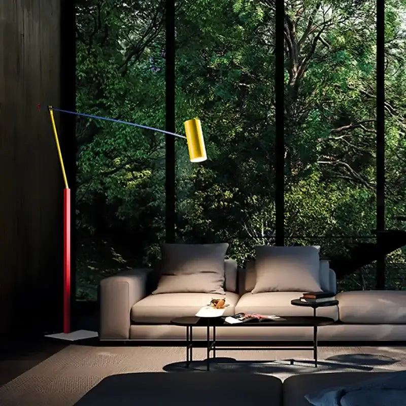 A decorbites colorful metal led adjustable floor lamp with a yellow cylindrical shade and red blue articulated arm
