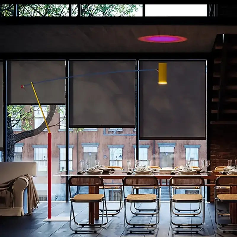 A decorbites colorful metal led adjustable floor lamp with a slender red pole and yellow arm for living room use