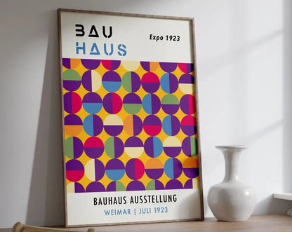 A framed DecorBites™ mid century geometric canvas art with vibrant overlapping colored circles on a white background