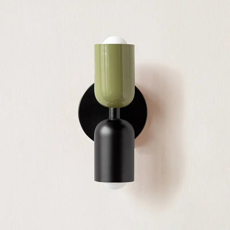 Decorbites™ olive-green modern wall sconce with a glass shade, matte black base, and circular backplate for indoor use