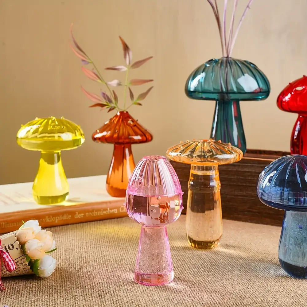 DecorBites™ colorful mushroom vase in translucent pink glass with ribbed cap and stem holding water