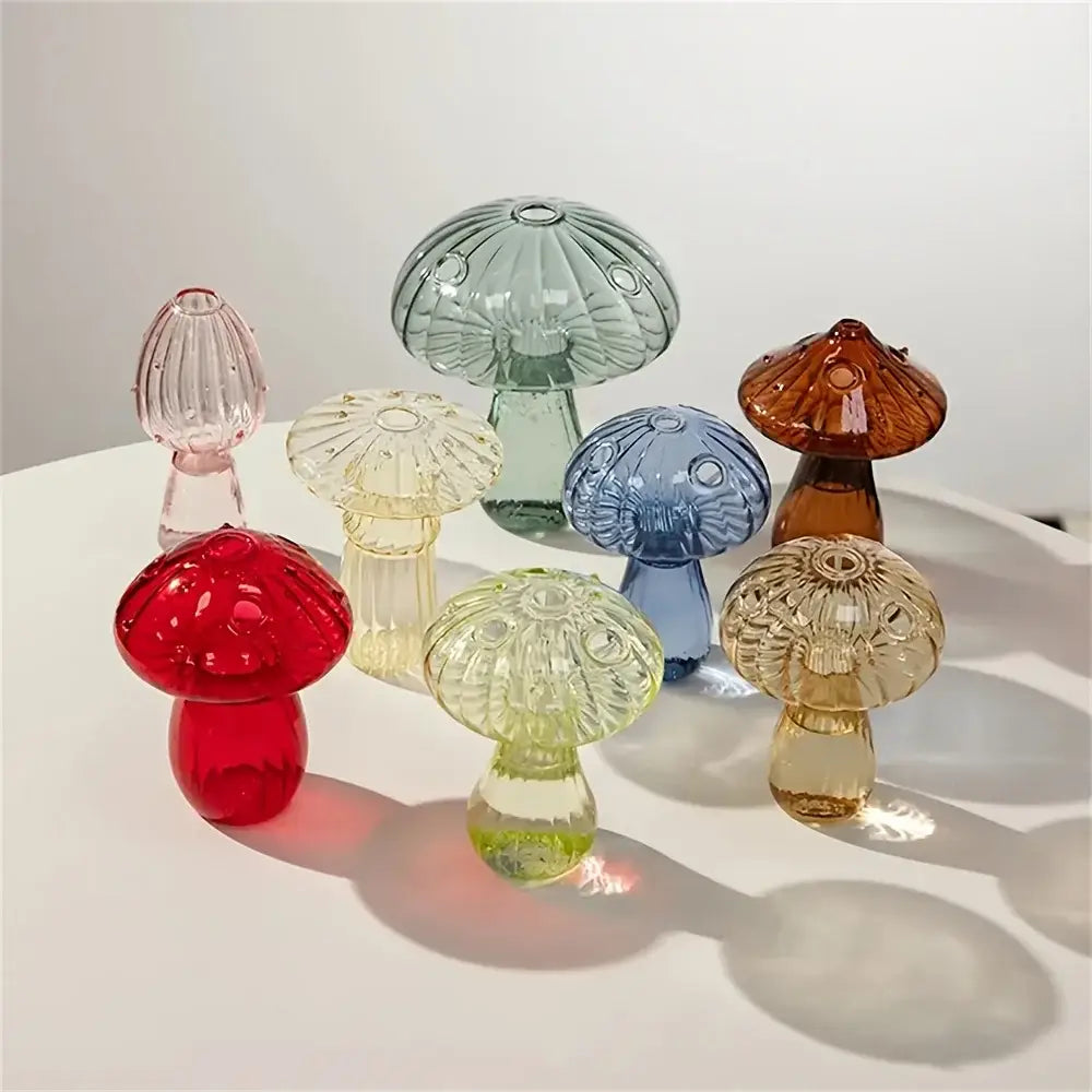 A colorful mushroom vase featuring translucent glass mushroom figurines in red green blue amber and clear for nordic decor