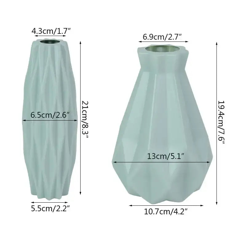 Two light blue ceramic vases with geometric faceted designs as modern flower vases for home décor by DecorBites™