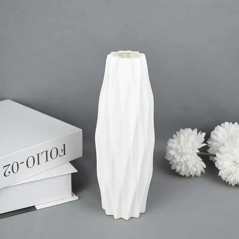 White ceramic flower vase with tall slender silhouette and vertical ridges for modern home décor by decorbites