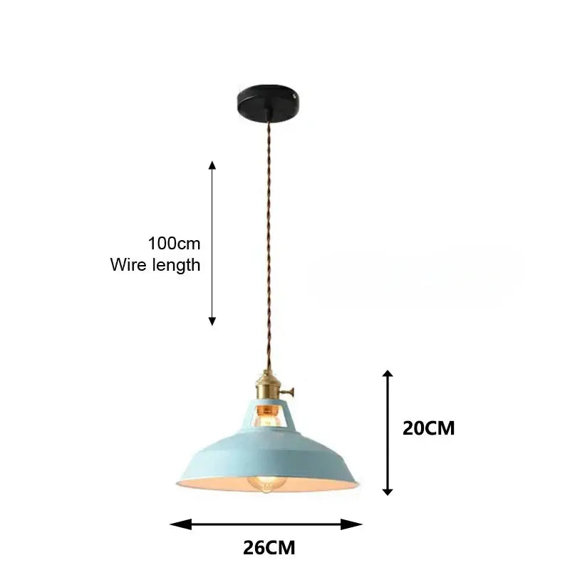 A vintage-style pendant light with a pale blue dome shade and brass accents from DecorBites colorful retro pendant lights