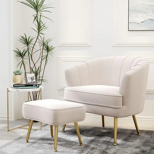 Cream-colored velvet decorbites comfortable beige bucket armchair with gold-tone legs and matching ottoman for living room