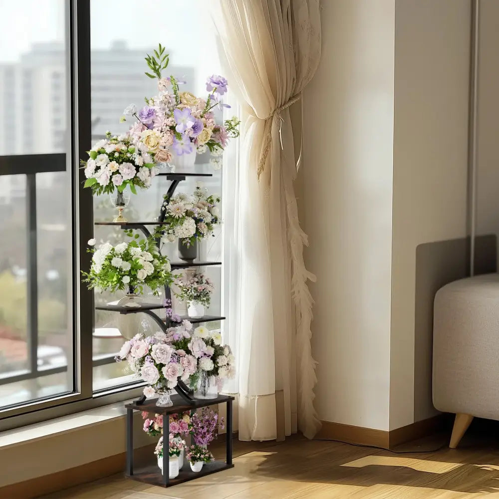 Black metal DecorBites™ compact tree plant stand with multiple shelves displaying floral arrangements in vases