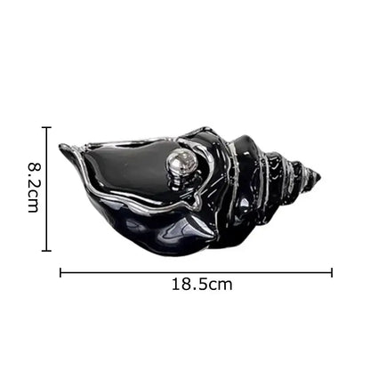 Black glossy ceramic decorbites conch ashtray with a silver metallic sphere for living room decor