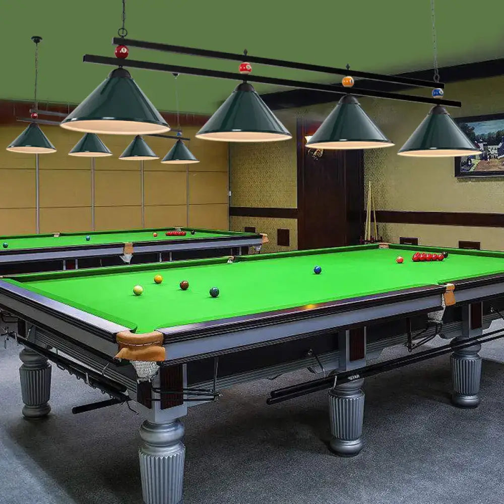 Elegant silver-finished pool table with green felt and ornate legs paired with decorbites metal pendant ceiling light