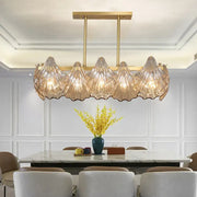 Decorbites contemporary amber crystal pendant light with five translucent glass shells and brass island lighting linear metal arm