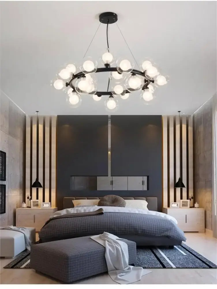 DecorBites™ contemporary black and gold chandelier featuring white glass balls arranged in a modern circular pattern