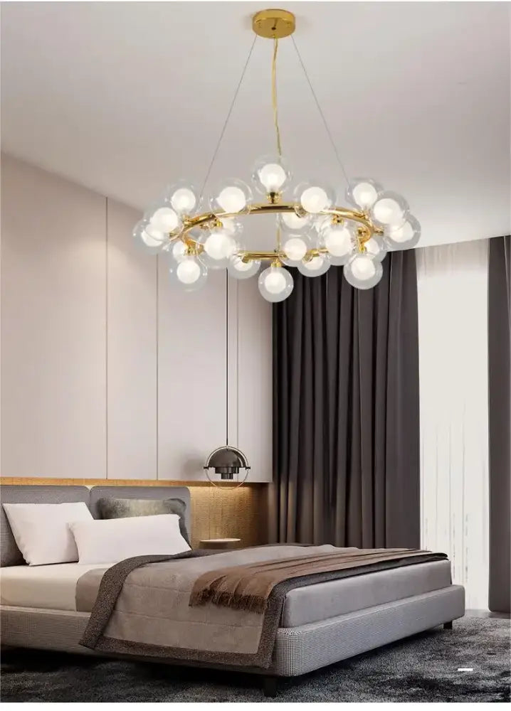 Decorbites™ contemporary black and gold chandelier featuring gold-toned frame with white glass ball bulbs in a modern design