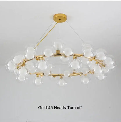 Decorbites™ contemporary black and gold chandelier with modern branching design featuring white glass ball bulbs