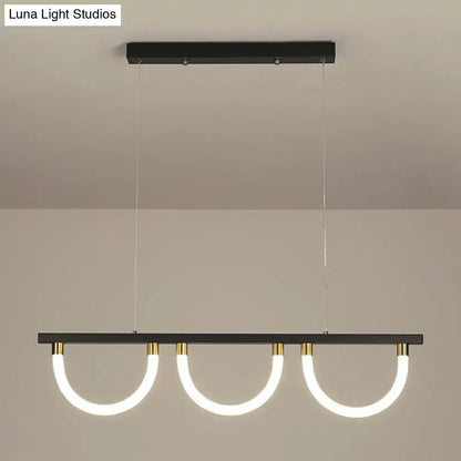 Modern black and gold DecorBites contemporary island lamp with three curved acrylic led rings for kitchen island lighting
