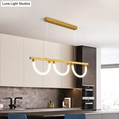 Gold-toned acrylic semicircle contemporary island lamp with three curved illuminated rings for kitchen island lighting