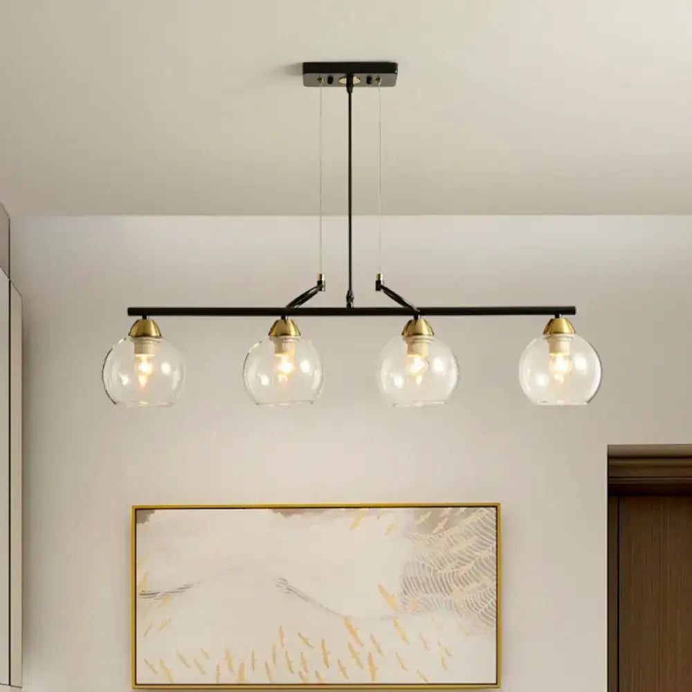DecorBites™ black metal bar pendant light with four clear prismatic glass globes and brass accents for dining hall lighting