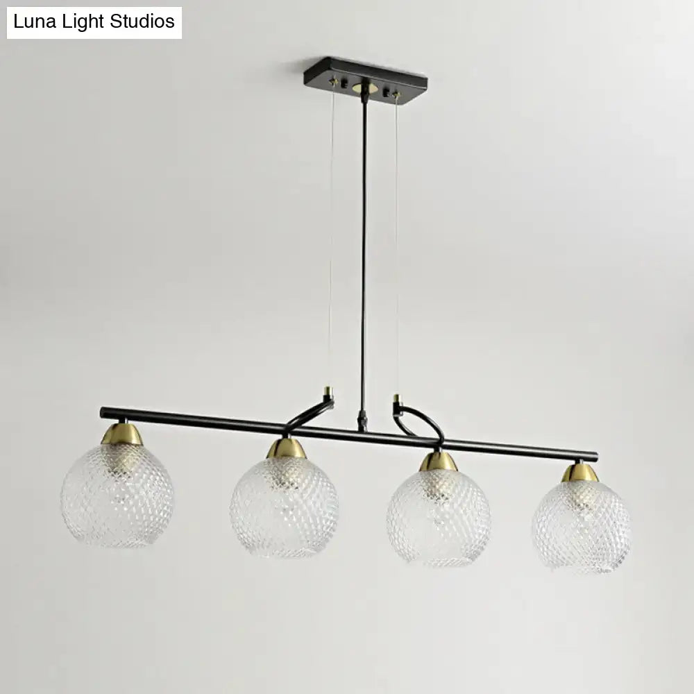DecorBites contemporary black metal pendant light with four clear prismatic glass globes and brass accents for dining hall