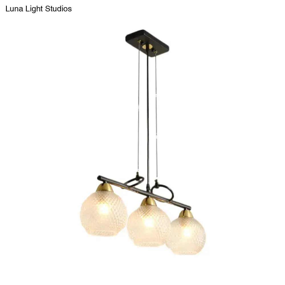 DecorBites contemporary black pendant light with three frosted globe shades and clear prismatic glass for dining hall
