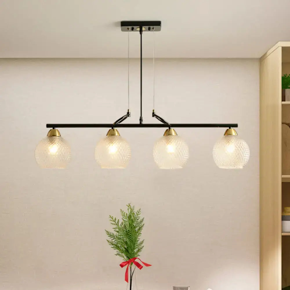 Decorbites™ contemporary black metal bar pendant light with four frosted globe shades and brass accents for dining hall with clear prismatic glass