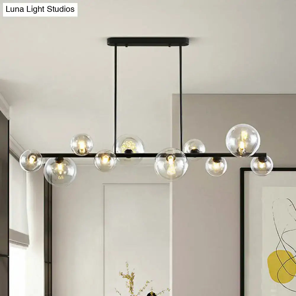 Modern black metal DecorBites ceiling light with clear glass globe bulbs, ideal for dining room illumination