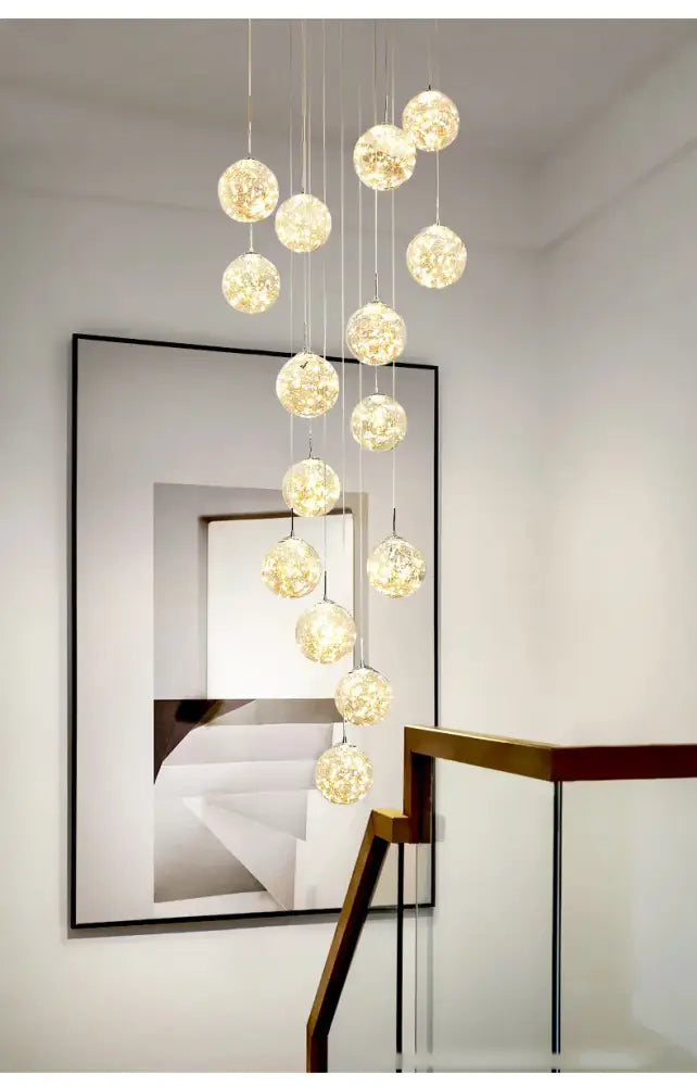 DecorBites™ contemporary crystal ball chandelier with modern spiral glass orbs emitting warm golden glow for dining room