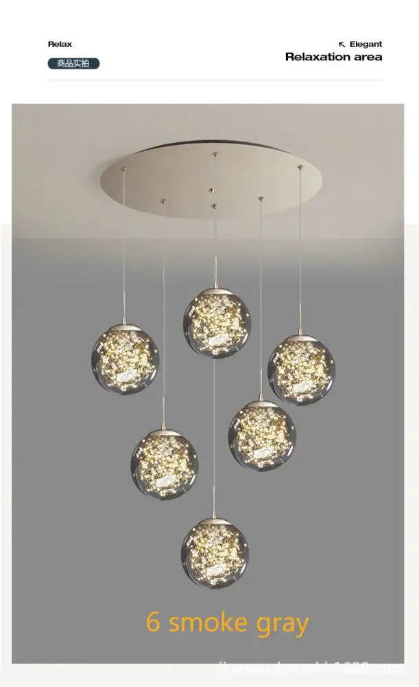 Six smoke gray crystal ball glass pendant lights hang from a circular fixture in this DecorBites modern spiral chandelier