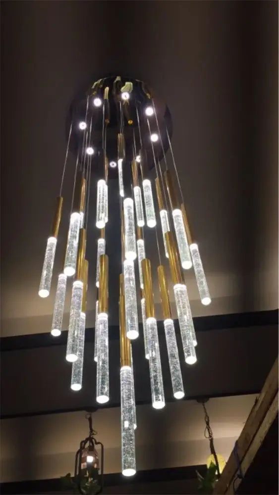 DecorBites™ contemporary crystal chandelier with cascading clear acrylic tubes and gold-toned metal accents for large staircase