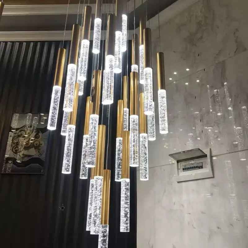 Decorbites™ contemporary crystal chandelier with gold-toned cylindrical frames and clear sparkling tubes for large staircase