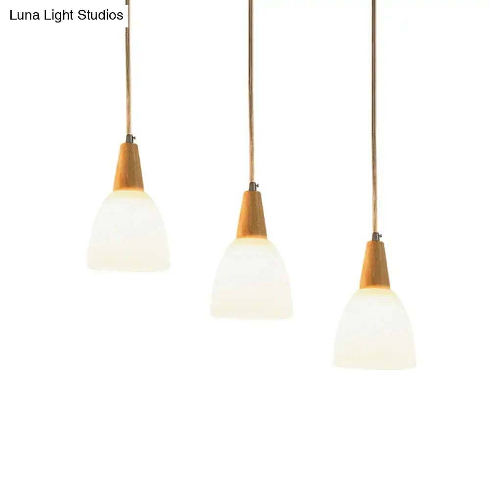 DecorBites™ contemporary 3-light beige suspension lamp with frosted glass dome shades and warm wood accents