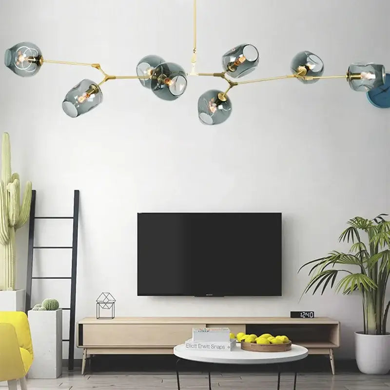 DecorBites™ contemporary glass bubble chandelier with gold metal arms and teal glass bubbles for living room lighting