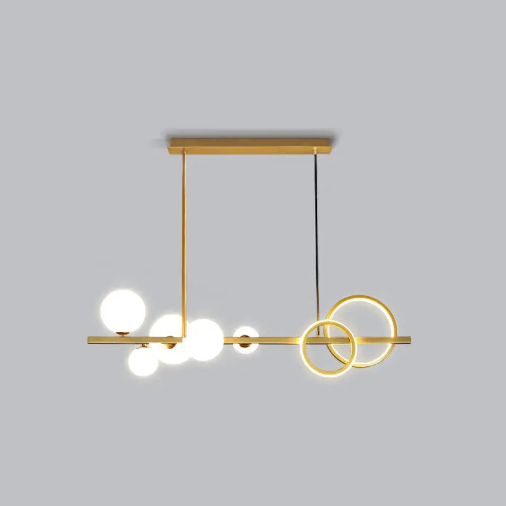 Decorbites contemporary gold-toned island lamp with milk white spherical bulbs and smoke grey circular rings for dining room