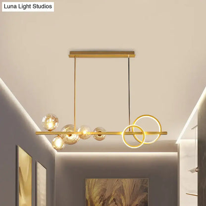 DecorBites contemporary gold-toned island lamp with hanging milk white glass globes and interlocking circular rings