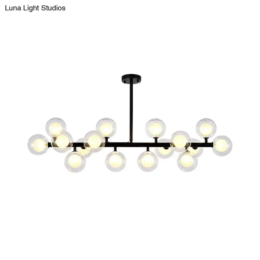 Black metal chandelier with 16 clear glass globe bulbs designed for contemporary living room island lighting by DecorBites