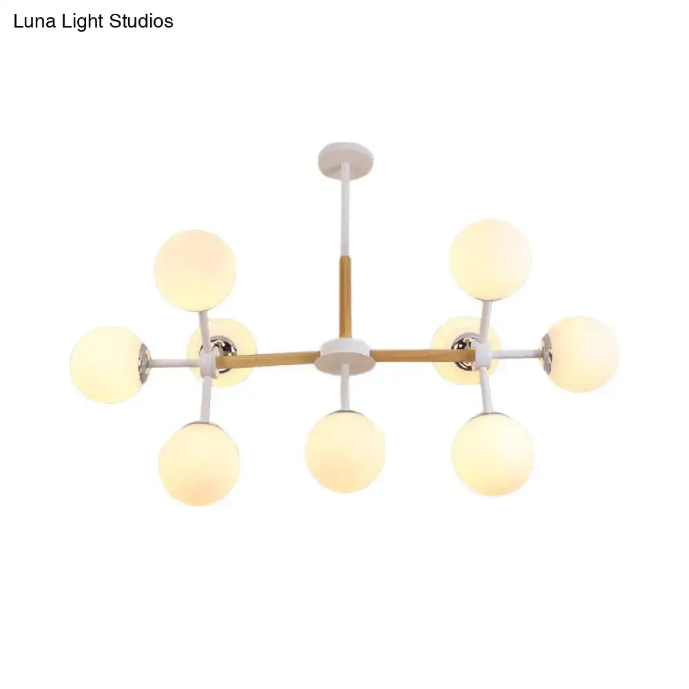 DecorBites modern chandelier with white glass globes and wooden crossbar for dining room hanging light kit