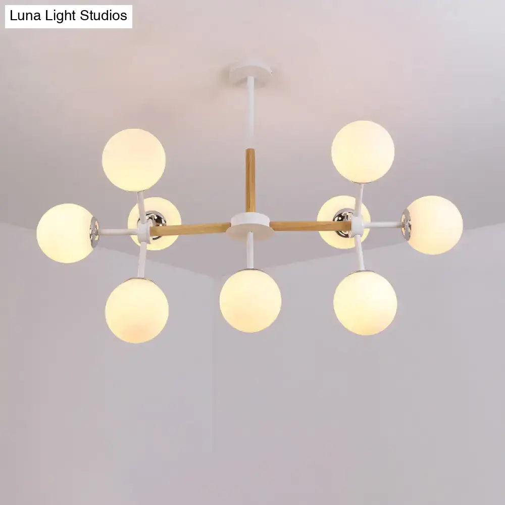 DecorBites™ contemporary globe chandelier with white glass globes and wooden crossbar for dining room hanging light
